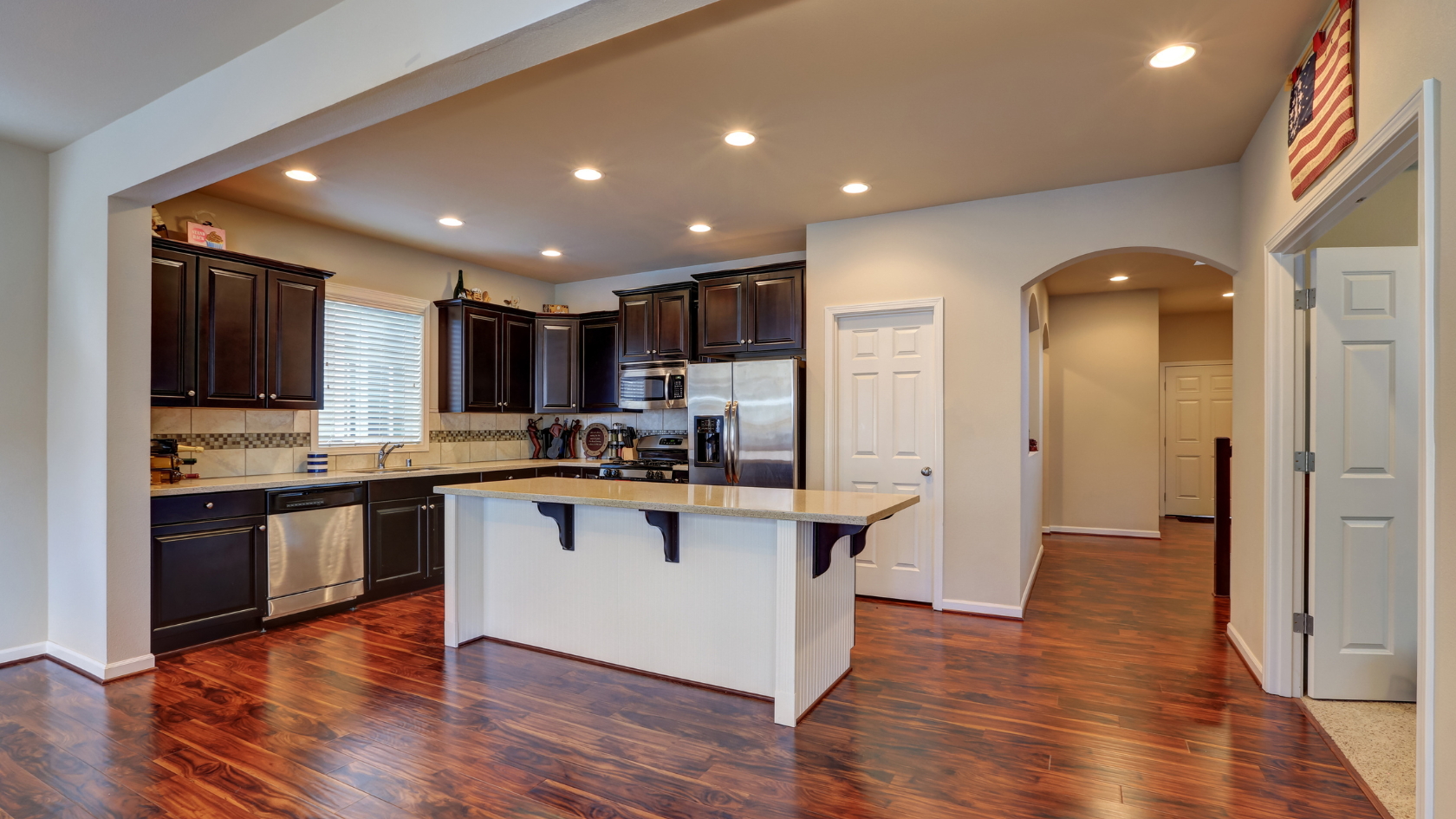 A large kitchen with a center island in the middle of the room